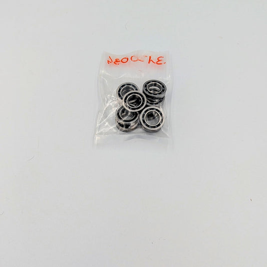 Pack of metal bearings in a clear plastic bag on a white background